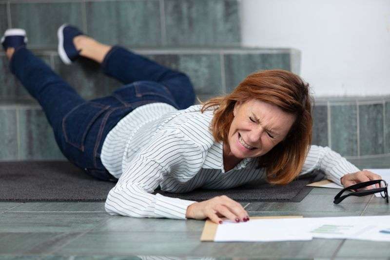 Businesswoman falling on stairs