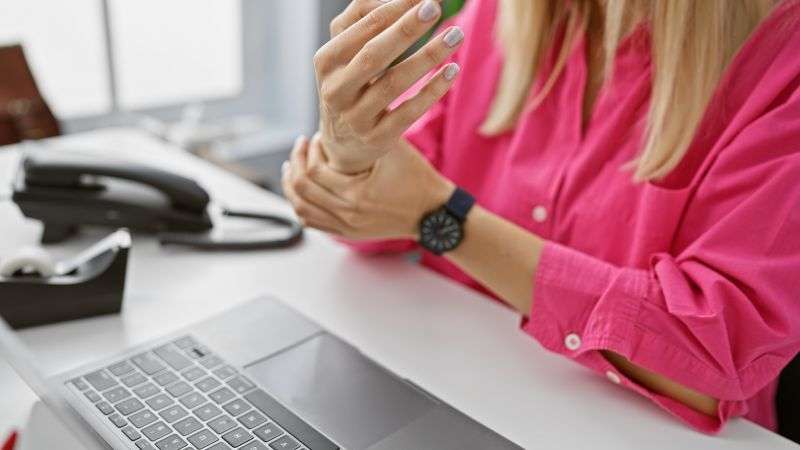 Woman experiences wrist pain in office setting